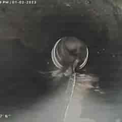 A sewer camera inspection revealed that this PVC pipe is broken. There's a split in bottom.